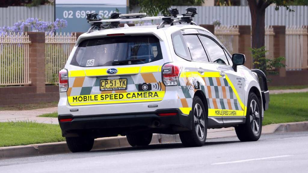 CHANGES: A mobile speed camera vehicle parked on the side of a suburban road. The 45 vehicles deployed statewide will soon have their high-visibility decals either reduced or removed. Picture: Les Smith